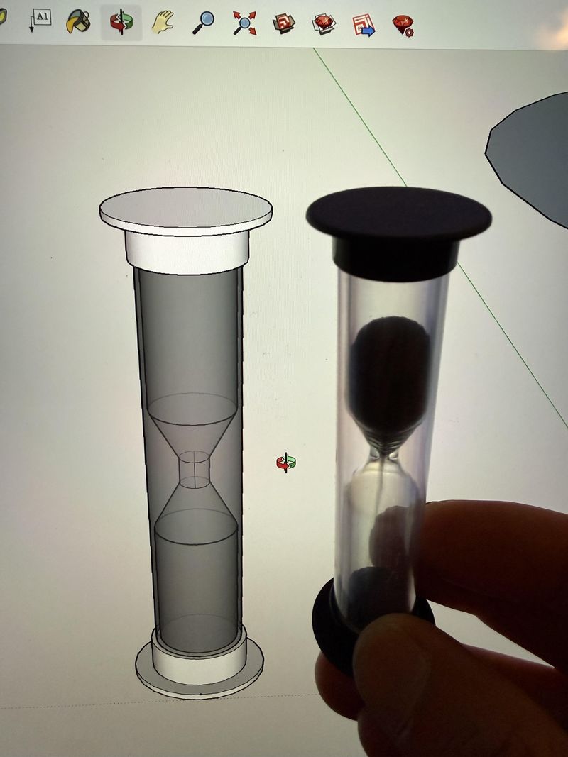 A modeled hourglass on screen beside the real one, by Cedric Tai