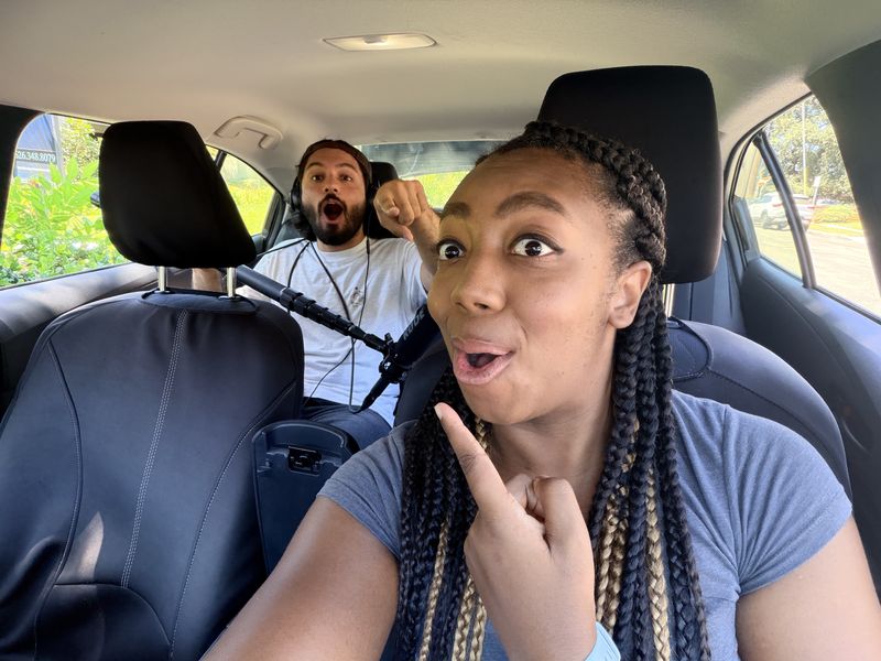 An actor mugging for the camera in a car, from Erik Dylan Matibag's shoot